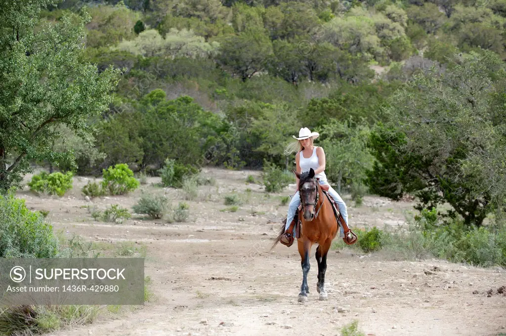 Horseback riding cowgirl