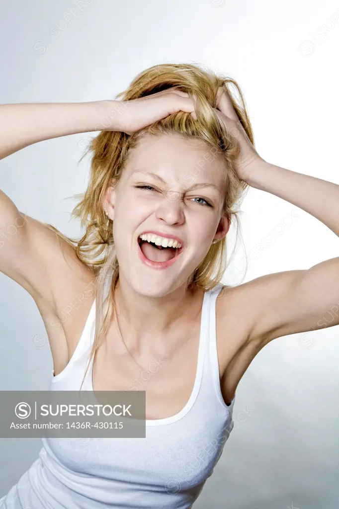 Young blonde woman playing with her hair