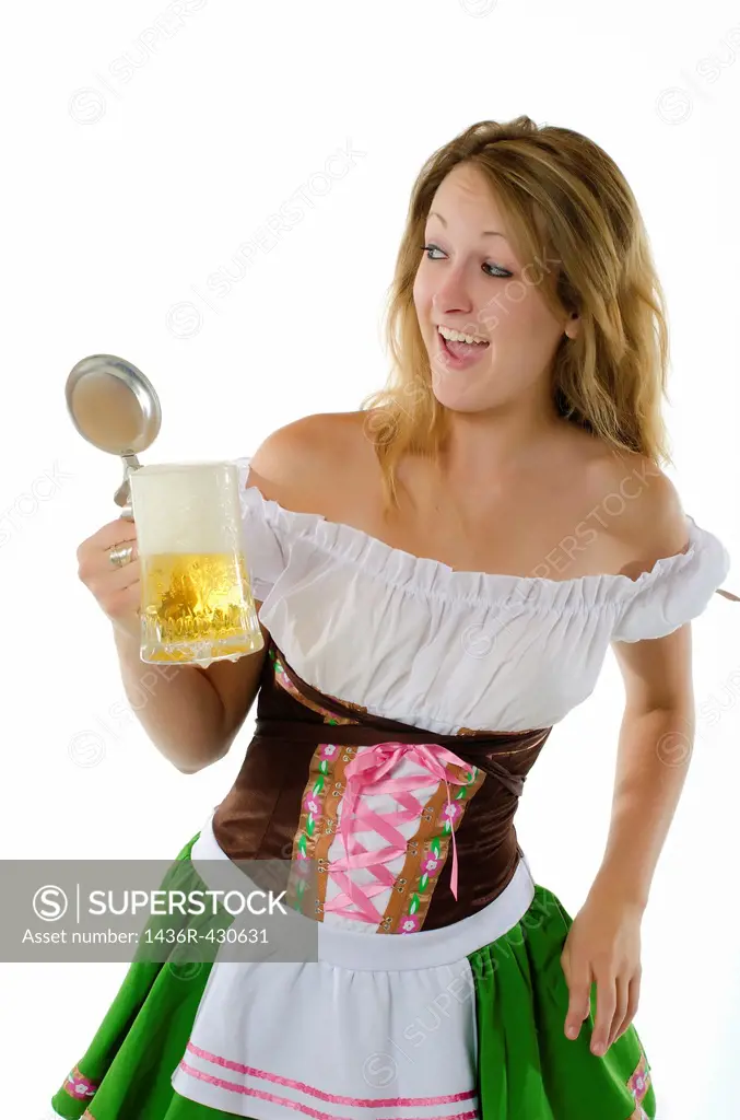 Woman in dirndl dress with beer mug