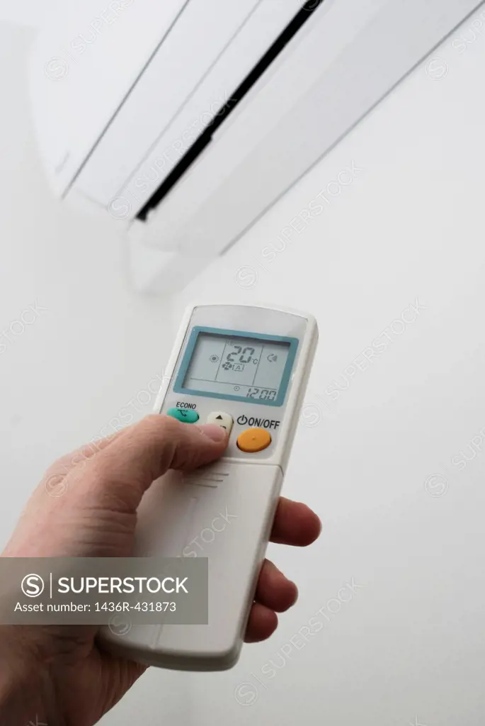 Adjusting the settings on a wall mounted air conditioning unit