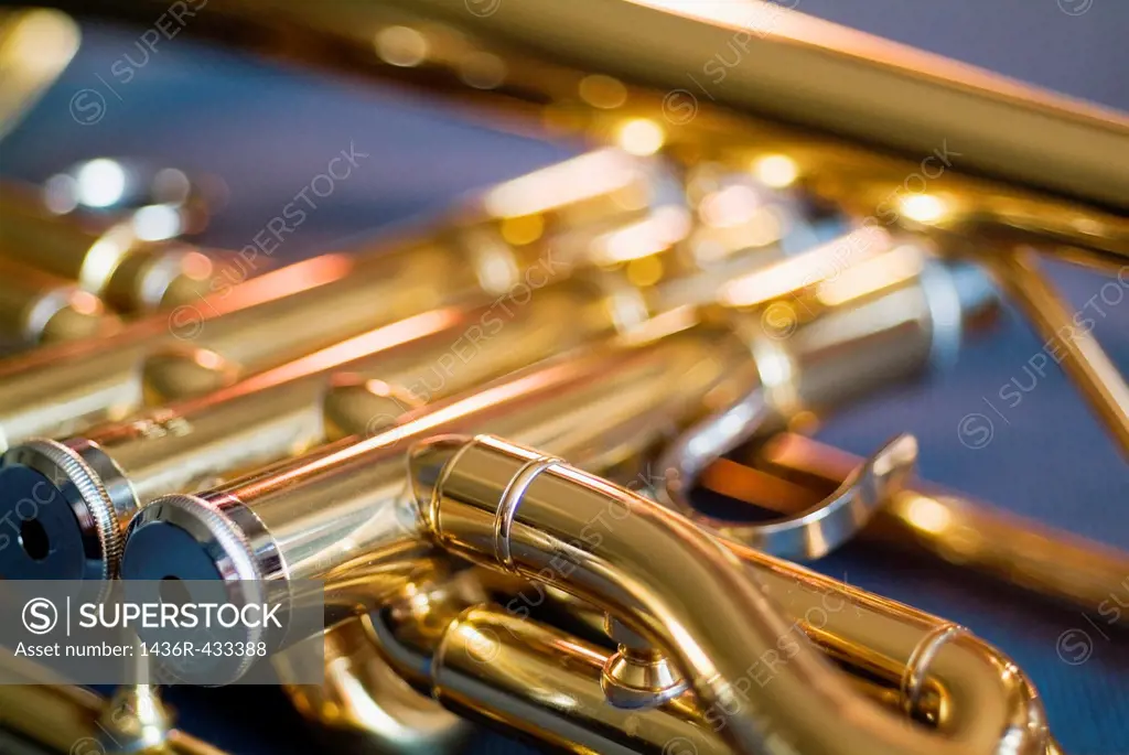 Three musical keys on a shiny trumpet