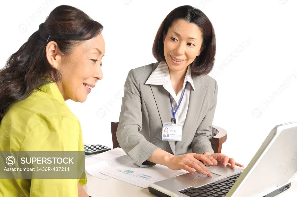 Senior woman and financial planner talking