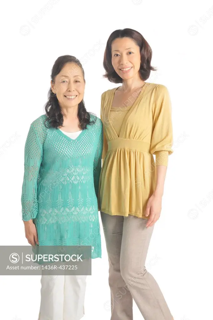 Senior woman and mid adult woman standing together
