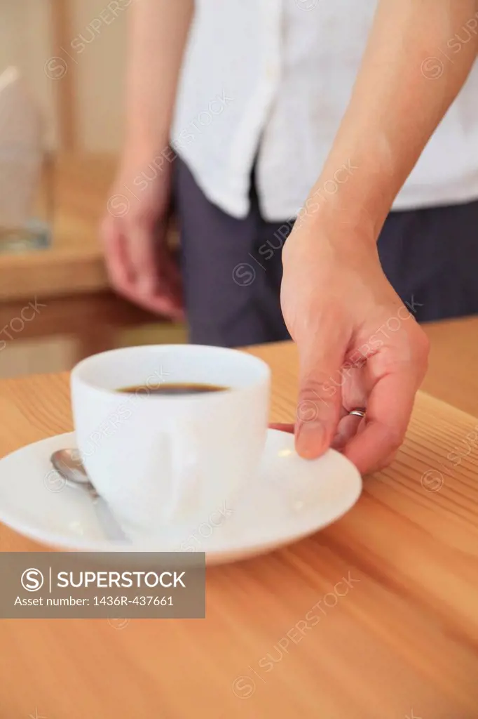 Waiter Serving Coffee