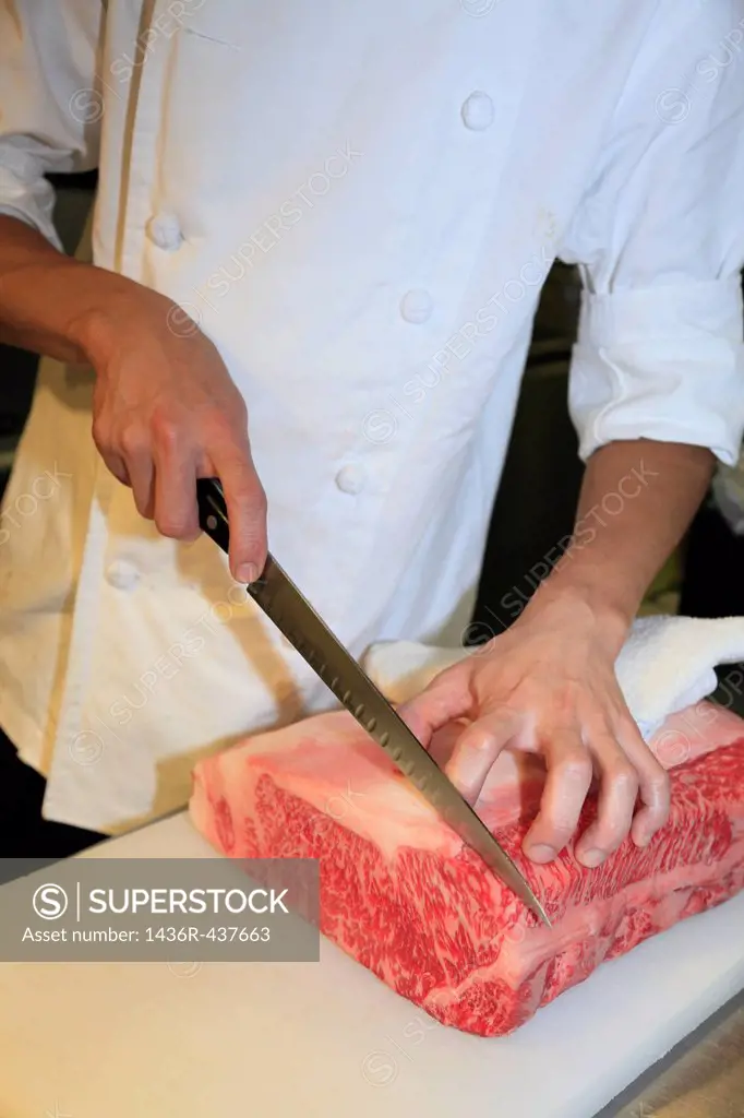 Chef Cutting Lump of Meat