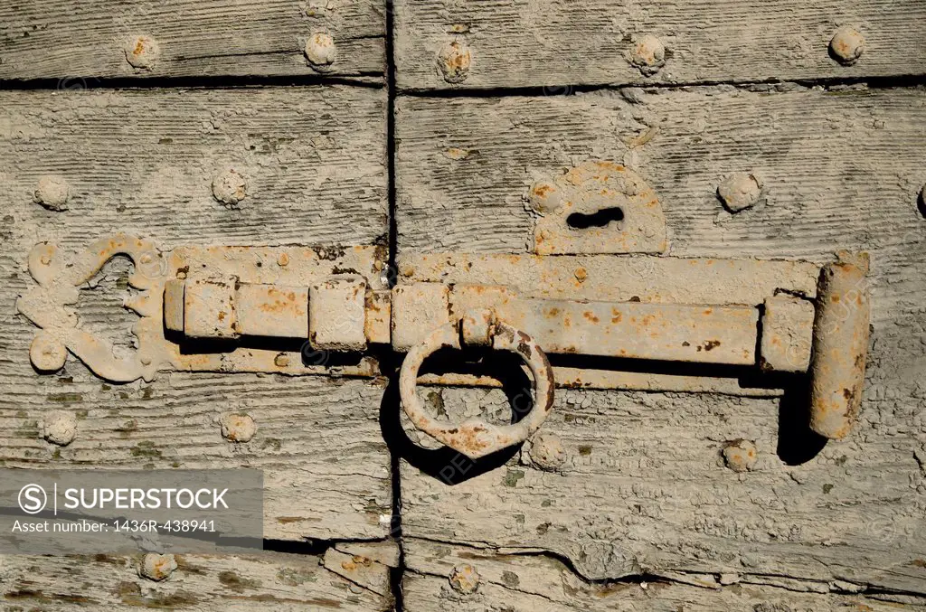 Old door lock on a wood door