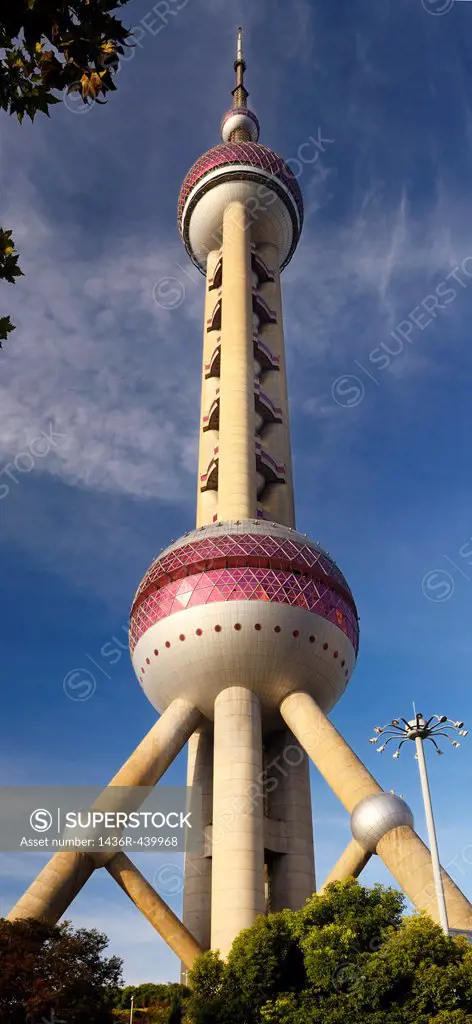 Oriental Pearl Radio & TV Tower at sunset with street lamp in Shanghai China