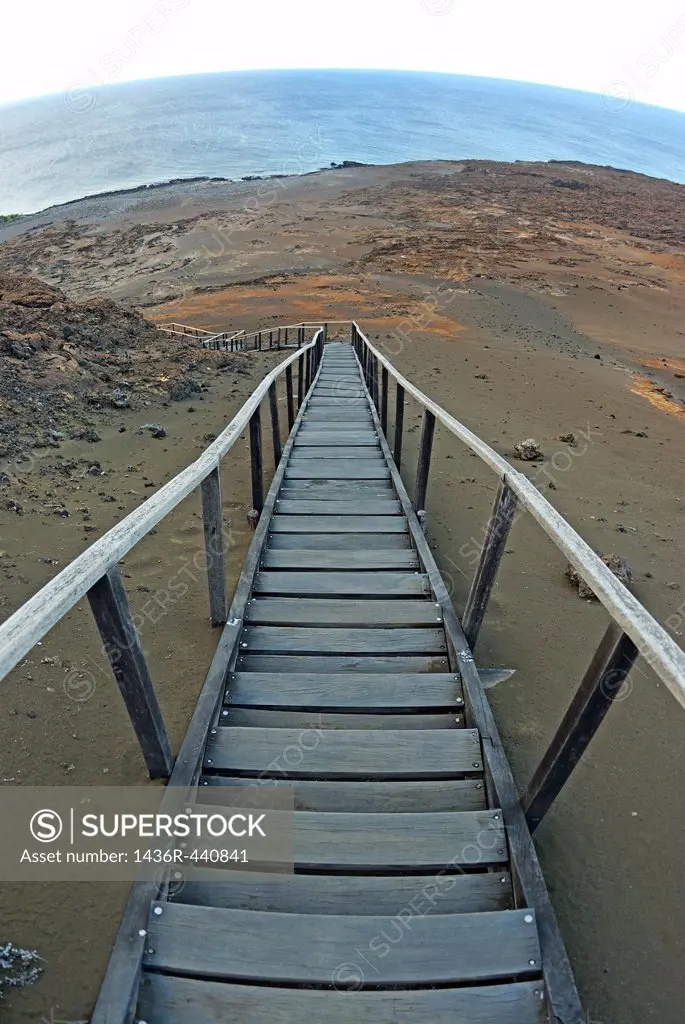 Staircase on volcanic landscape leading to sea, Bartolome Island, Galapagos Islands, Ecuador