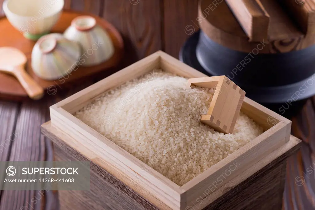 Rice and Measuring Cup in Box