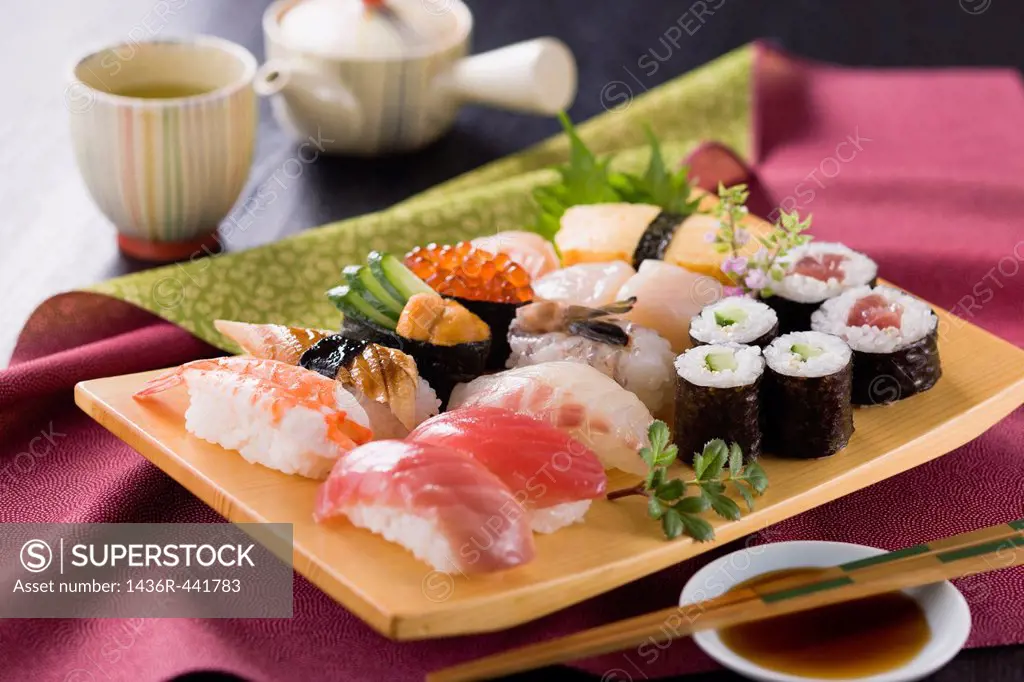 Assorted Sushi on Wooden Plate