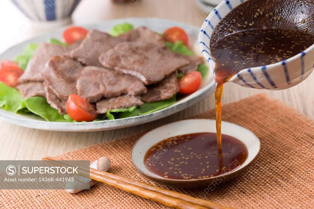 Pouring Korean Barbeque Sauce into Plate