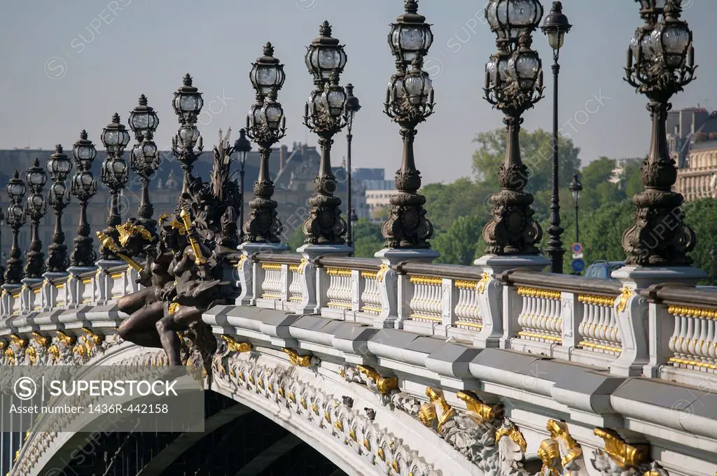 Le Pont Alexander III spans the river Seine leading to Les Invalides in Paris, France