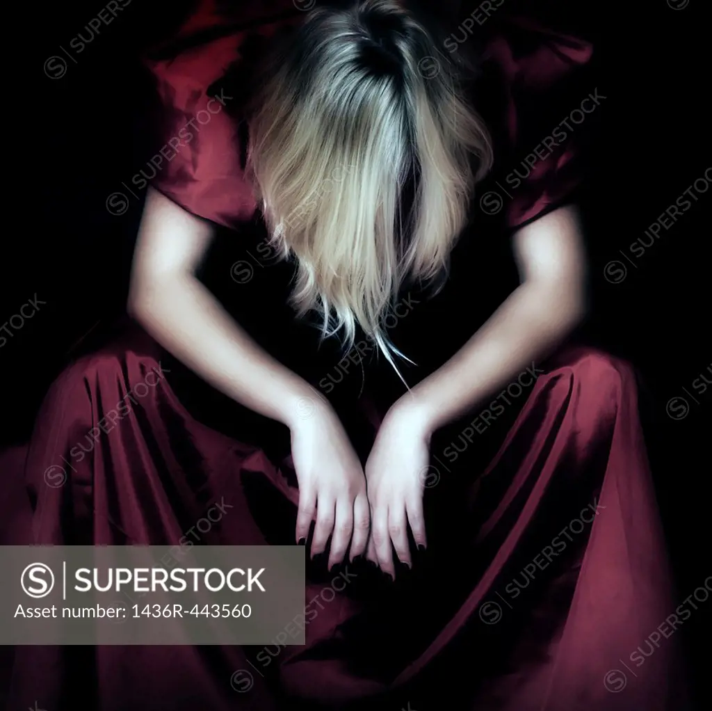 a woman in a red dress totally exhausted