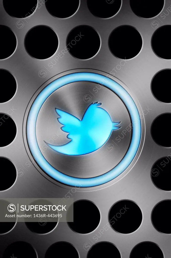 Blue glowing TWITTER icon button on an Apple Mac style brushed aluminium background  Concept image