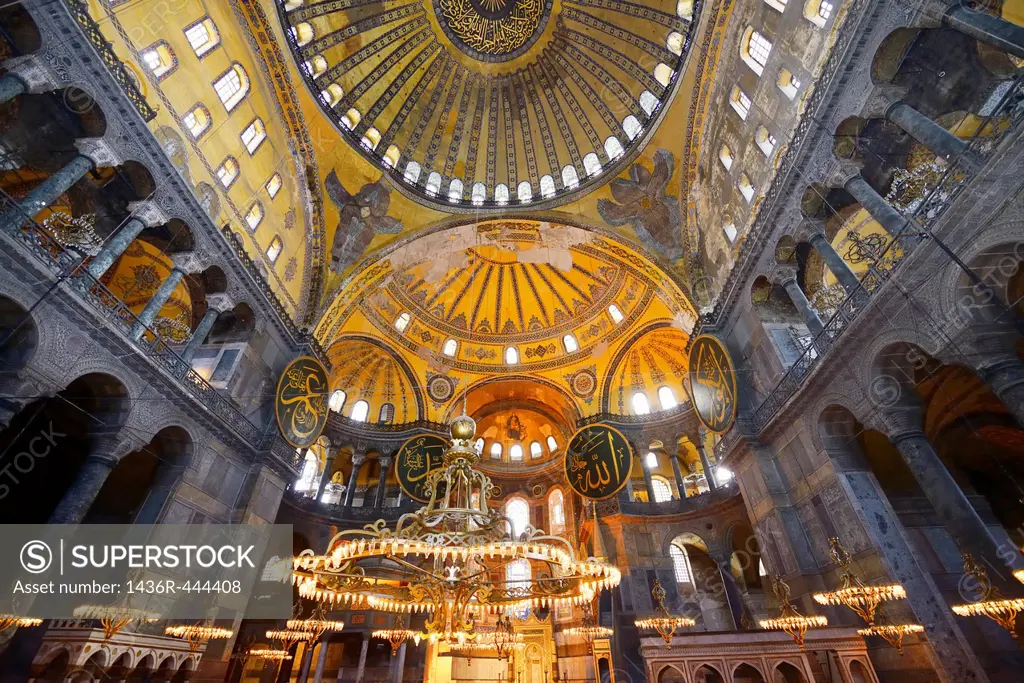 Ceiling domes and lit chandeliers with six winged Saraphim in the Hagia Sophia Istanbul