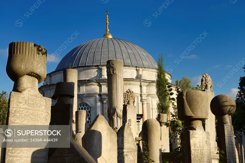 Sun on grave stones and Mausoleum in the Ottoman cemetery at Eyup Sultan Mosque Istanbul