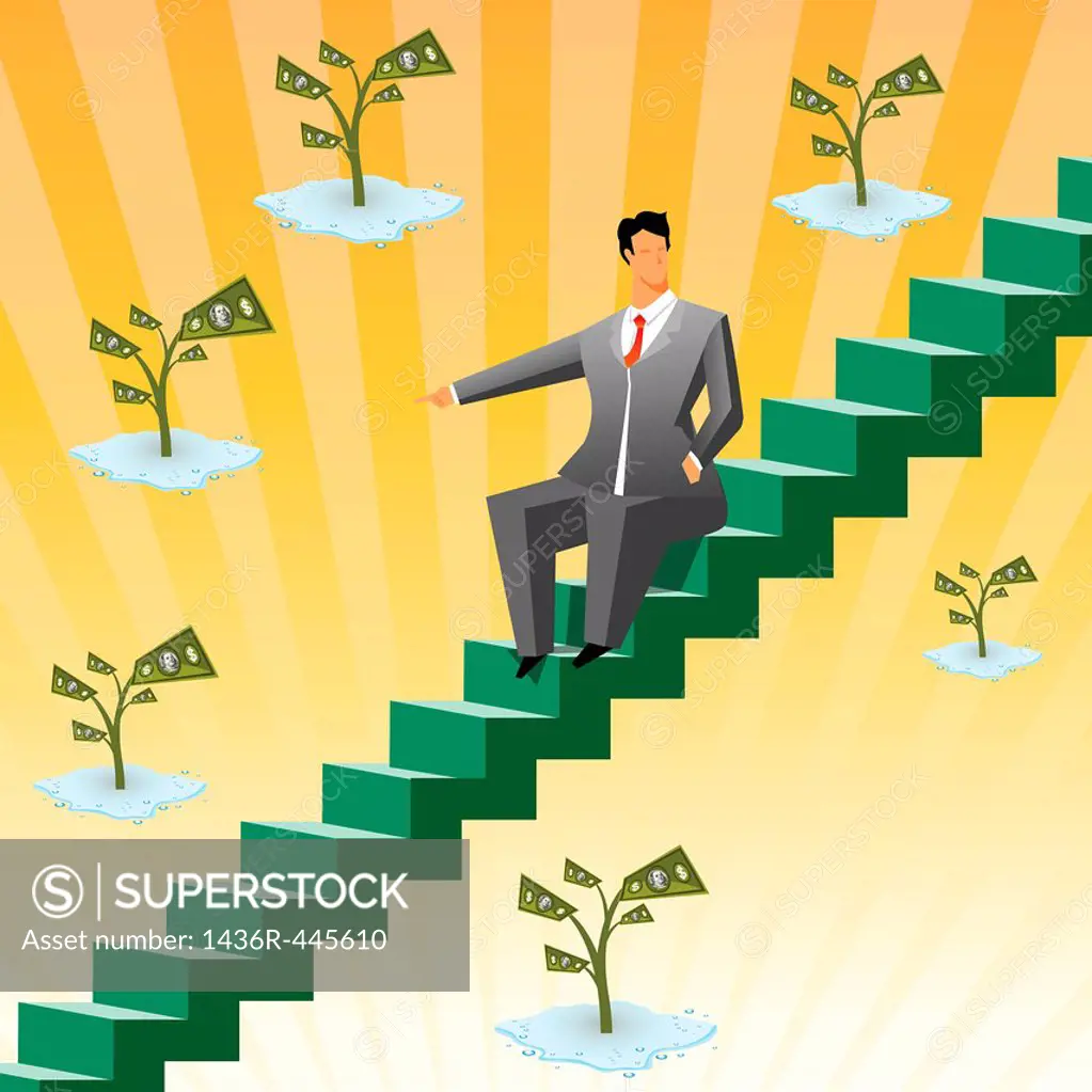 Businessman sitting on boxes and pointing towards money plants