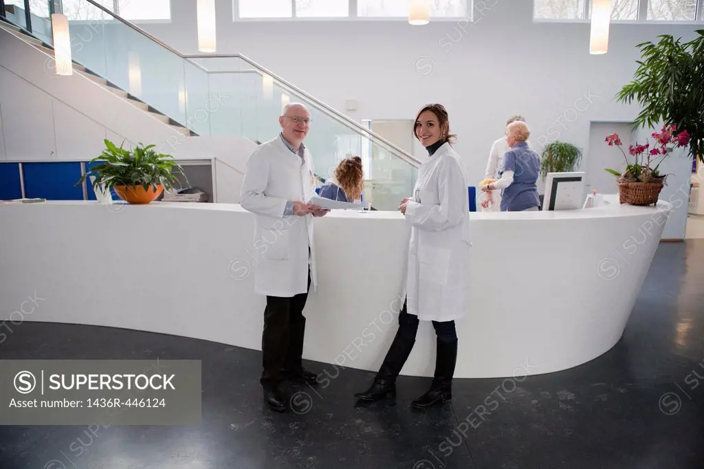 Doctors at reception in a modern hospital,Germany