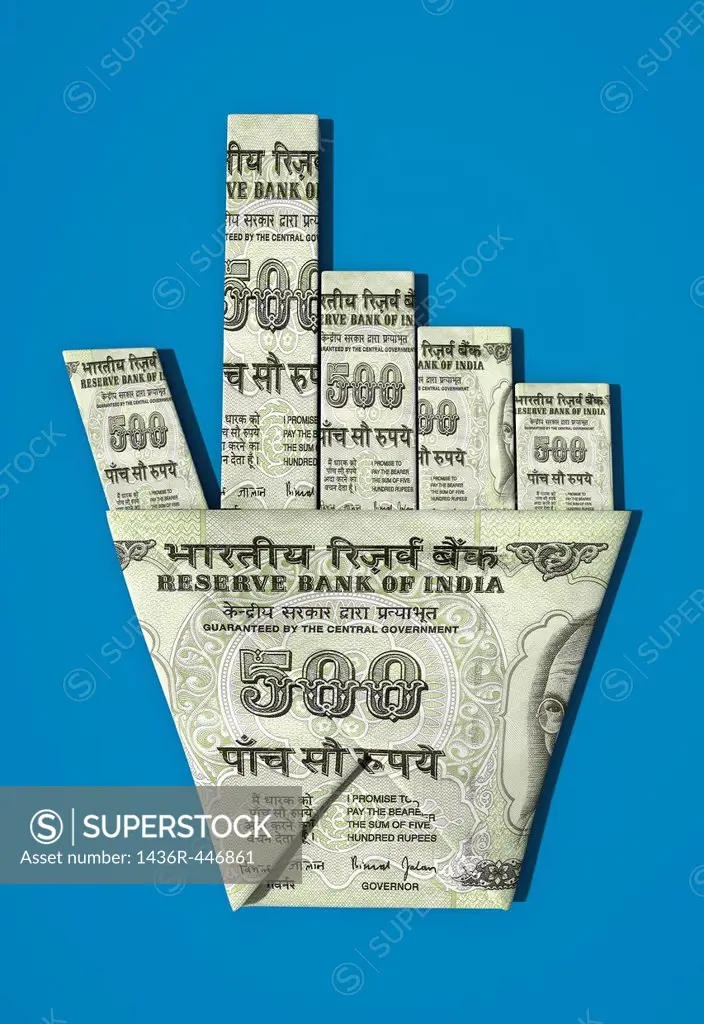 Indian banknote origami of mouse pointer over colored background representing the concept of investment in IT sector