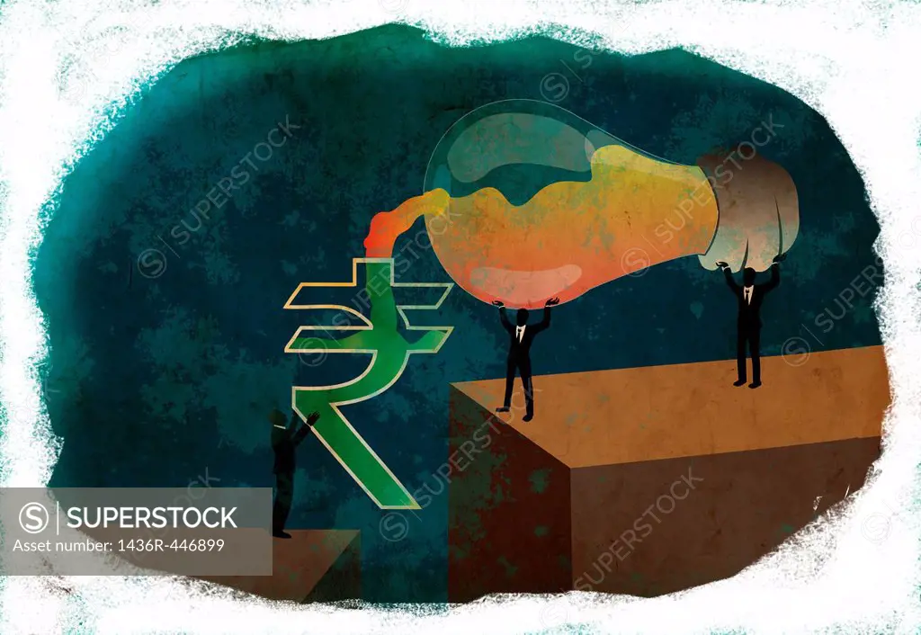 Conceptual shot of business people pouring ideas from light bulb into rupee sign depicting money making