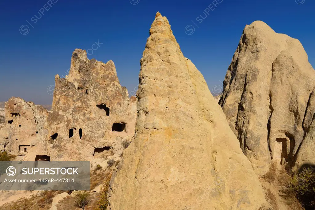 Fairy Chimney caves at Goreme Valley Open Air Museum Turkey with Nunnery and Buckle Church