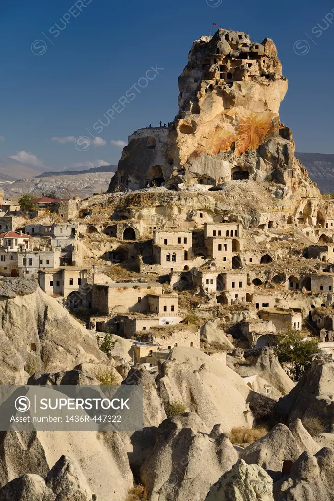 Fairy Chimneys Houses and Ortasihar Castle rock being repaired as a museum Cappadocia Turkey