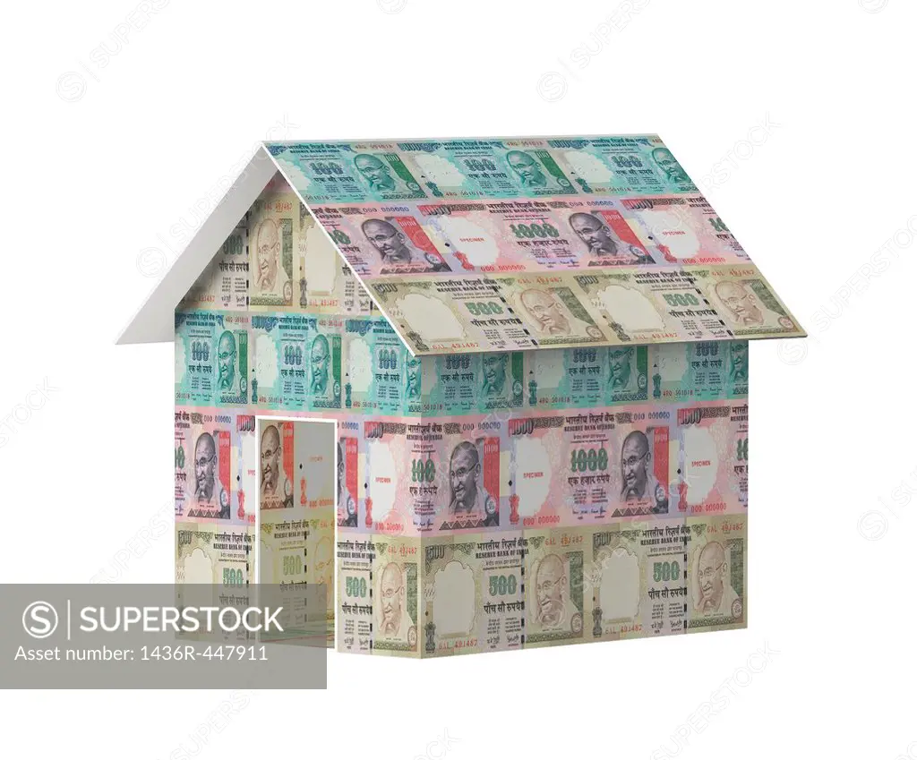 Close-up of a model home covered with rupees