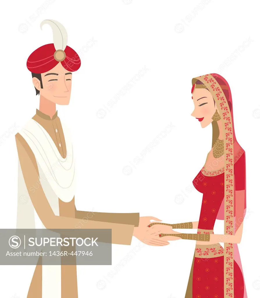 Indian bride and groom in traditional dress at wedding ceremony