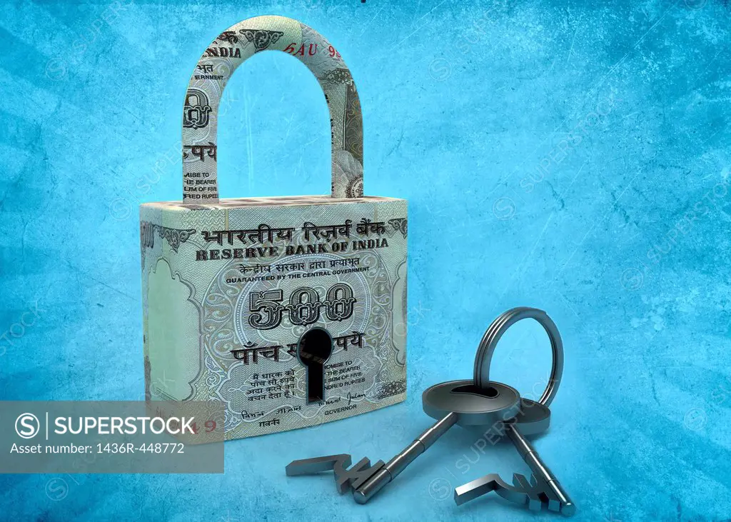 Padlock covered in paper currency with Rupee symbol key