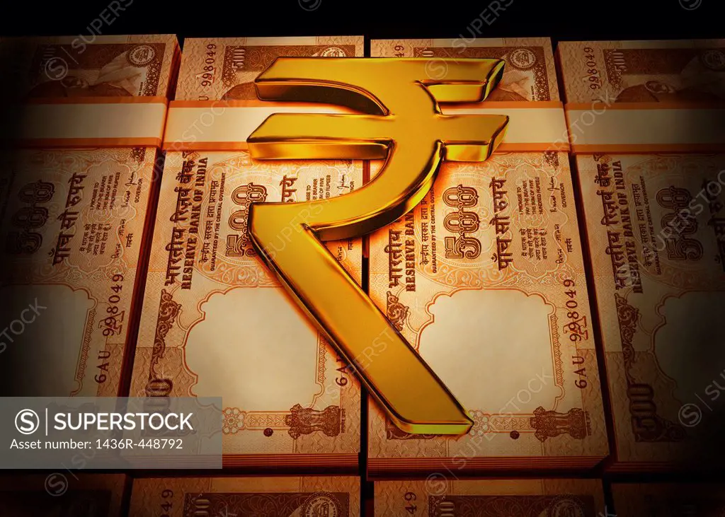 Golden Rupee symbol on Indian currency bundles