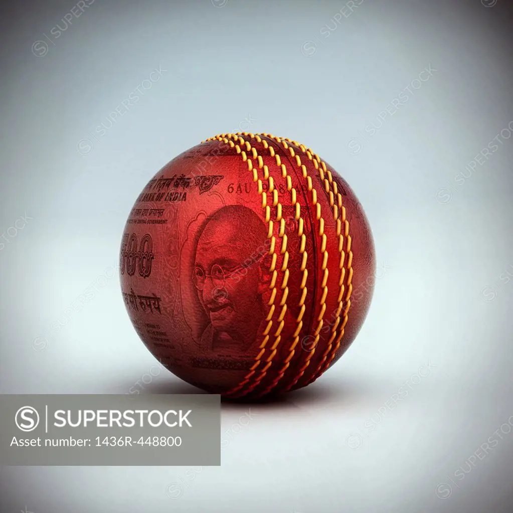 A cricket ball with Indian currency