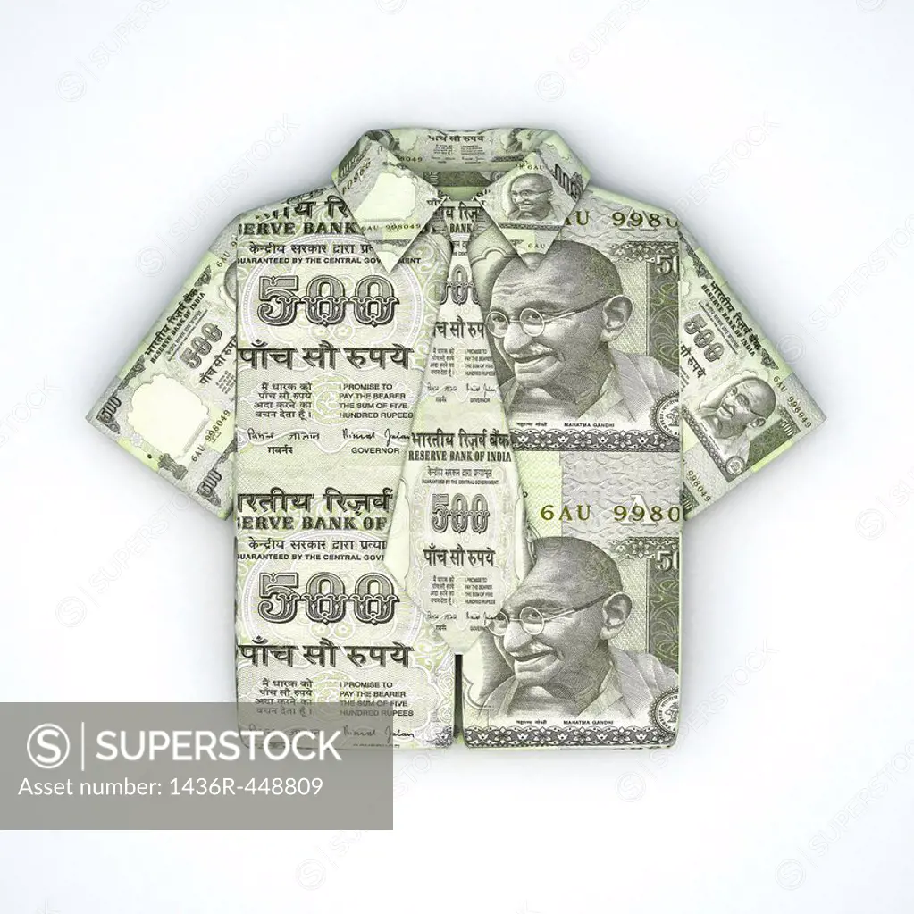 Indian five hundred Rupee note folded into the shape of a shirt and tie