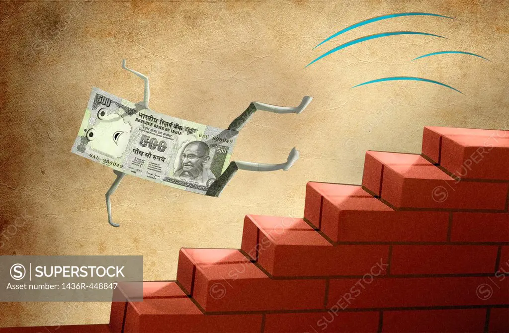 Indian five hundred Rupee note falling down from brick stairs