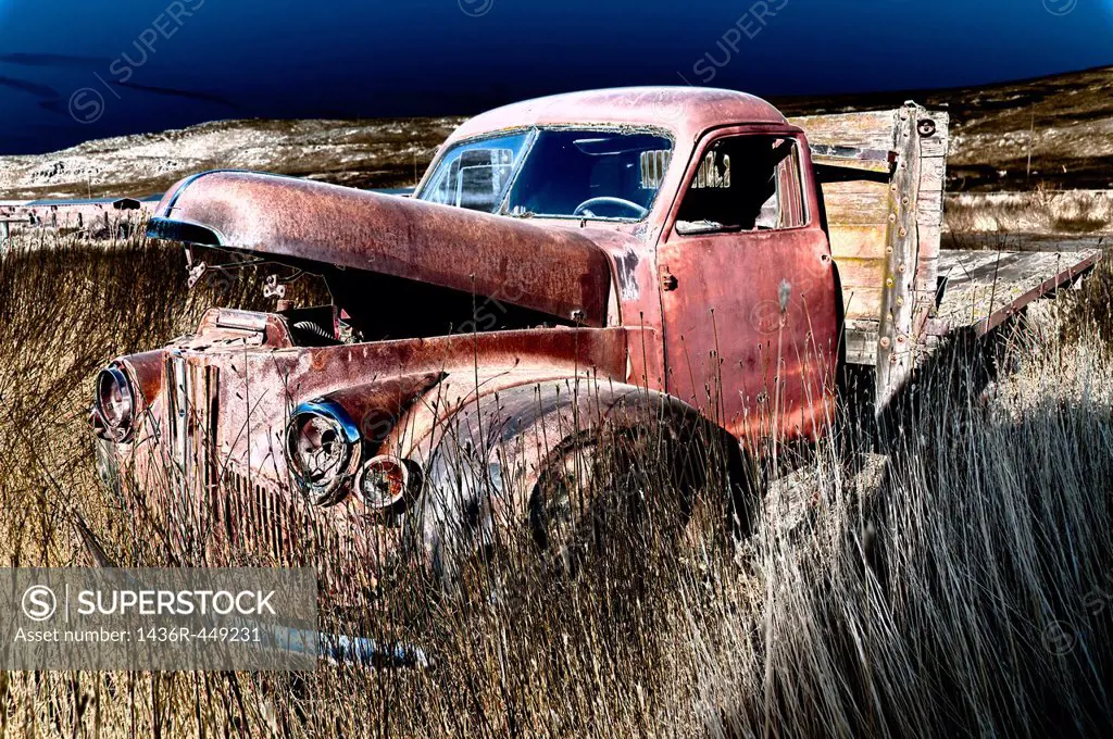 Old Pickup truck in farm field that has been solarized.South East Washington.USA