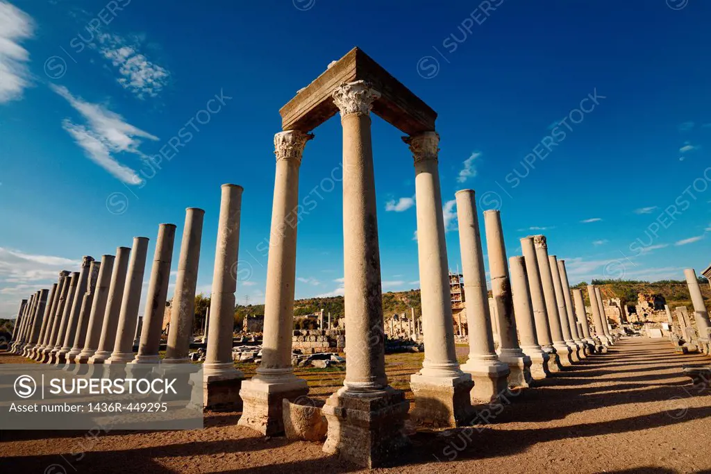 Colonade and corner pillars with lintel of Agora ruins at ancient Perge archaeological site Turkey