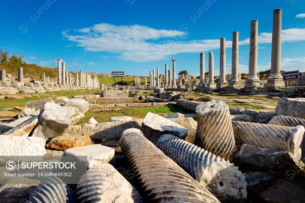 Collection of pillars in ruins of water canal on main street colonade of Perge Turkey