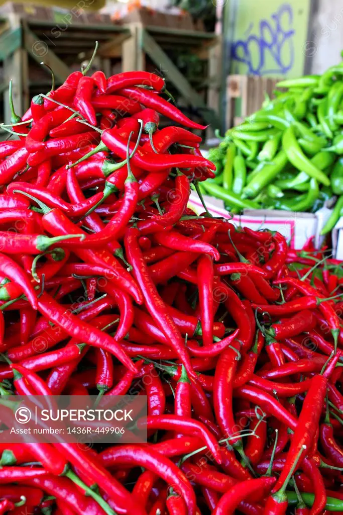 Stall selling red hot chilli peppers Photographed at the Carmel Market, Tel Aviv, Israel.