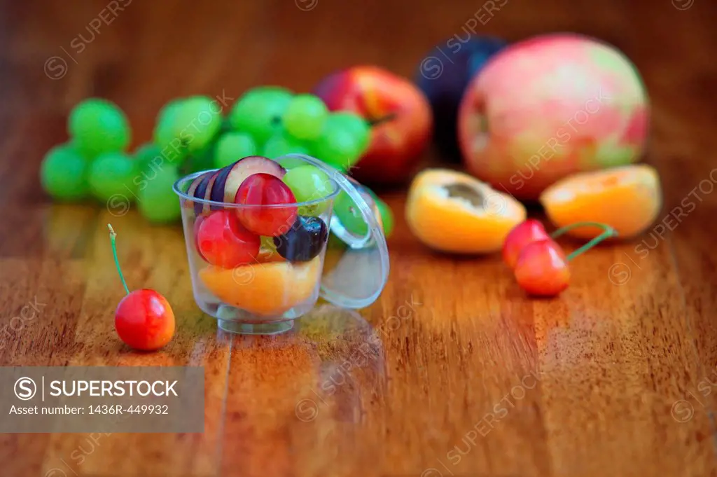 Freshly cut fruit salad with apple, grapes, peaches and cherries.