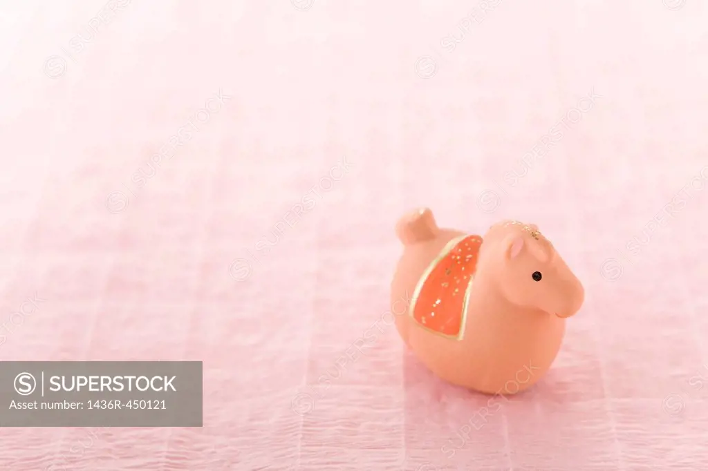 Toy Horse on Pink Paper