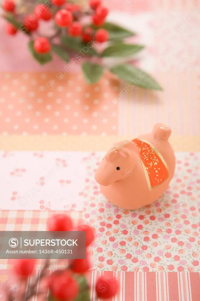 Toy Horse and Red Berry on Pink Paper