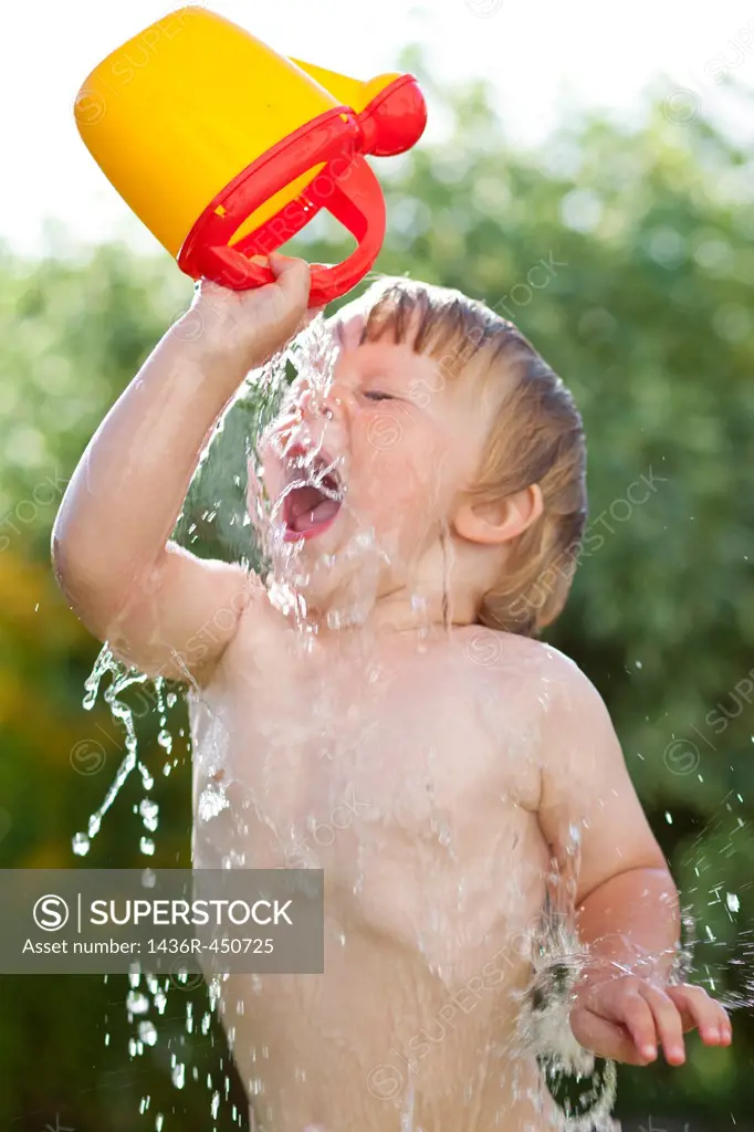 fun kid splashing water.