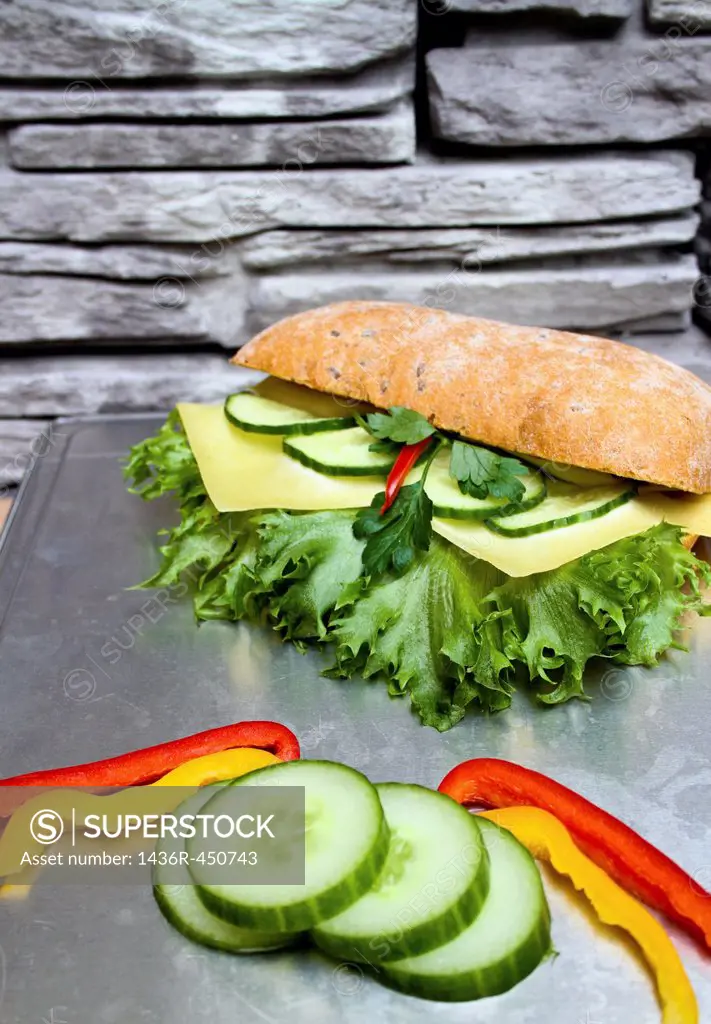 Fresh Sandwich with cucumber, cheese, pepperoni,lettuce,cheese and bread.