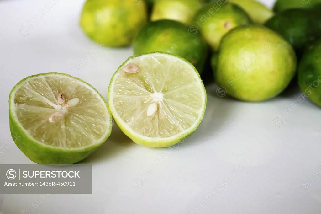 Fresh limes on white background.