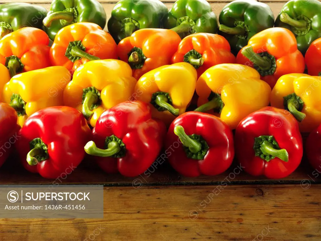 Mixed red, green, yellow and orange fresh bell peppers.