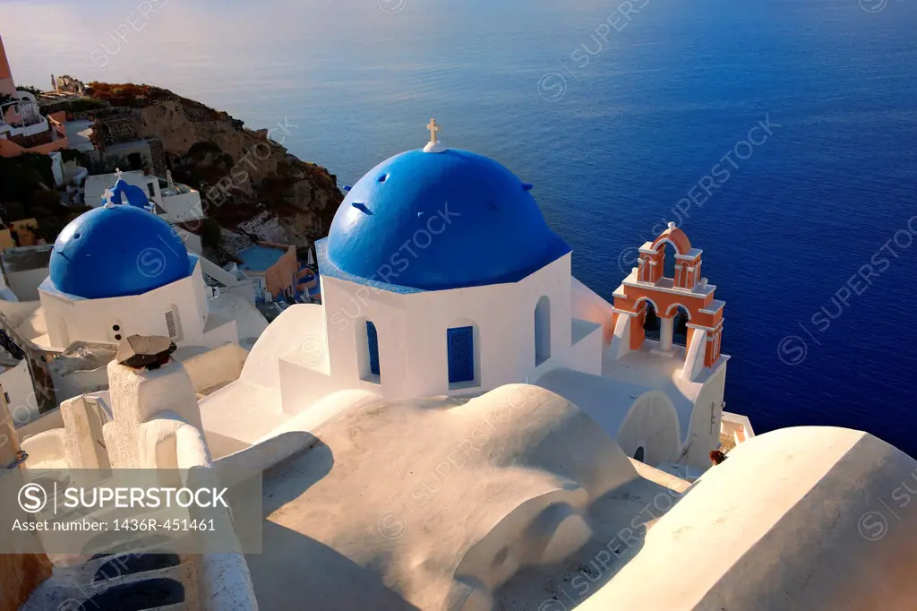 Oia, Ia Santorini - Blue domed Byzantine Orthodax churches, - Greek Cyclades islands