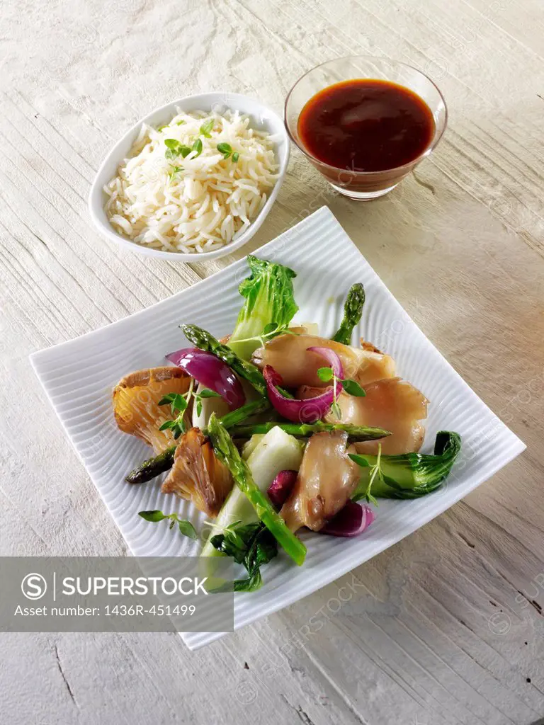 Oriental vegetarian stir fry of vegetables,, pak choi, asparagus & hoisin sauce.