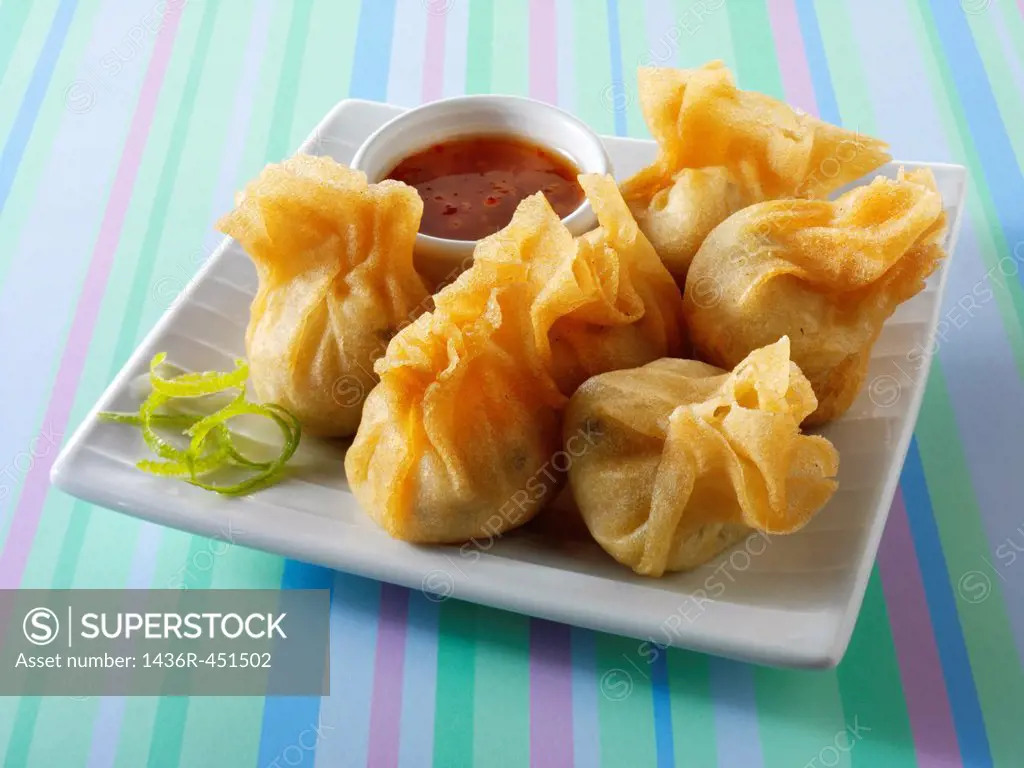 Traditional chinese dim sum with a chilli dipping sauce.