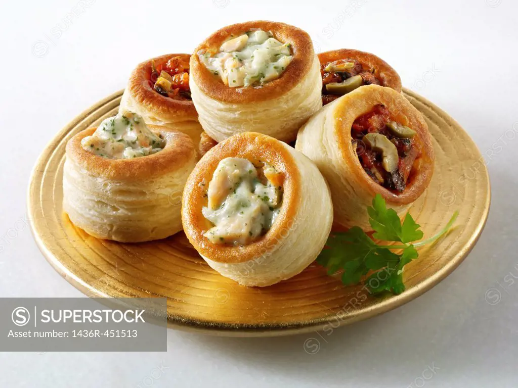 Volavents filled with salmon & dill cream and olive tapenade.