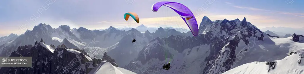 Paragliders over the Alguille du Midi for the Mont Blanc Massif, Chamonix Mont Blanc, France.