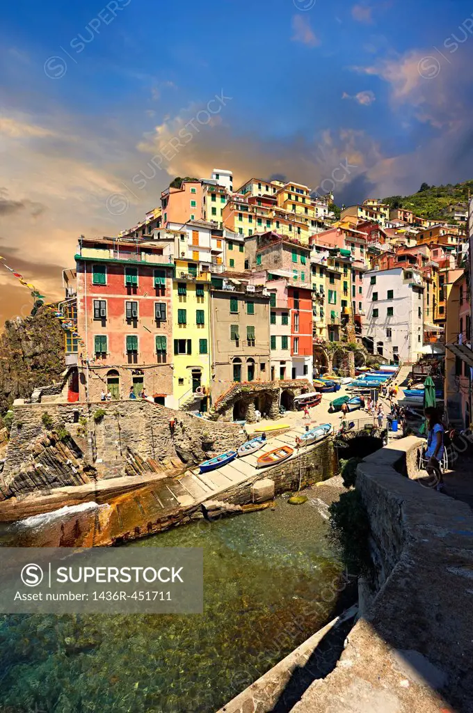 Photo of the colorful houses of the fishing port of Riomaggiore, Cinque Terre National Park, Liguria, Italy.
